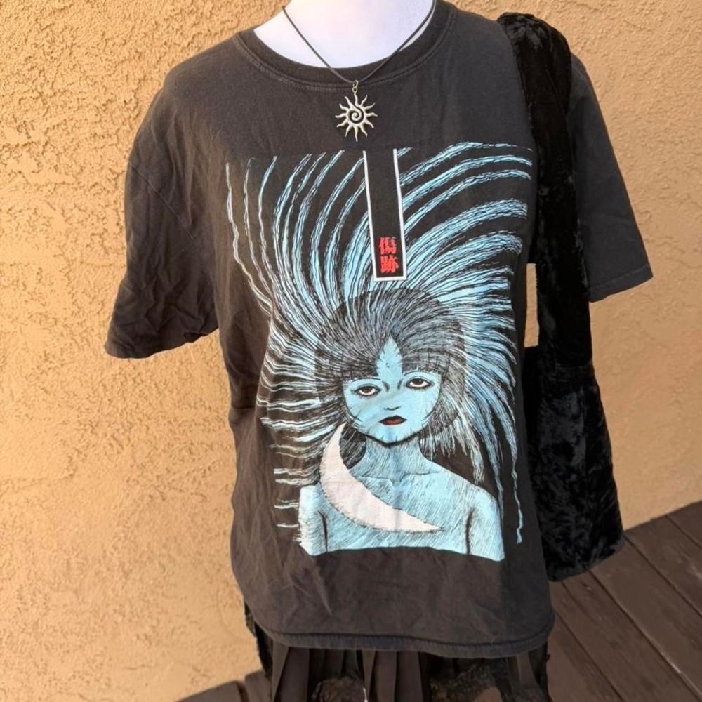 Izumaki black and blue graphic tee with a unique design